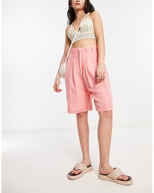 Free People linen high rise longline shorts in coral-