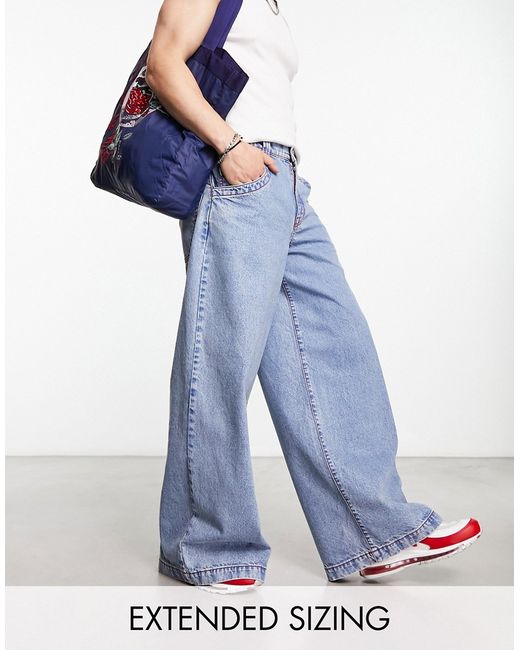 Asos Design extreme wide leg jeans with red contrast stitch in wash