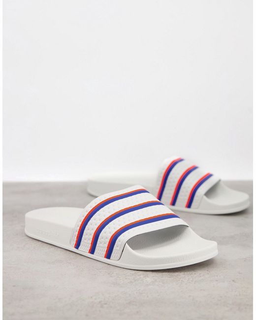 Adidas Adilette slides in white-