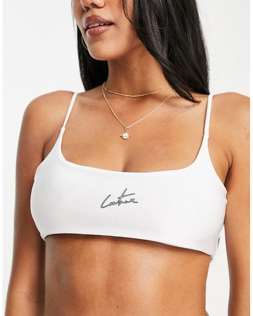 The Couture Club scoop logo bikini top in