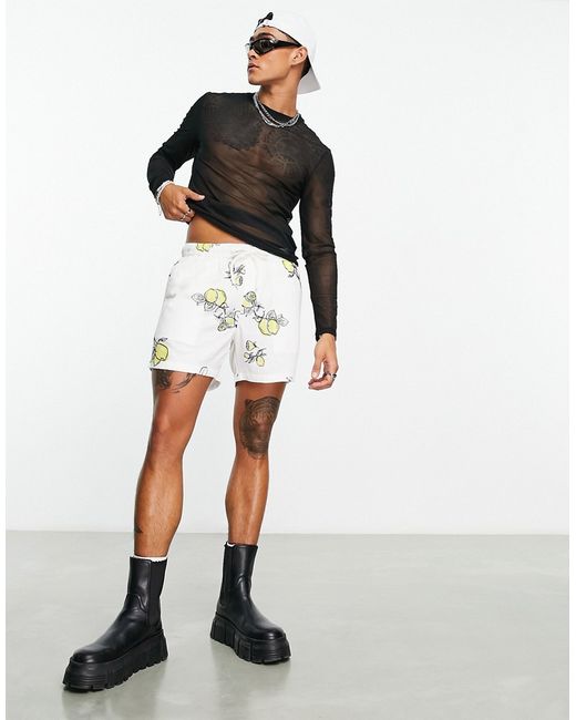 Asos Design slim linen shorts in shorter length with lemon print-