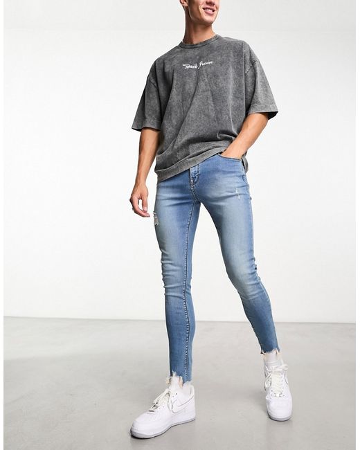 Asos Design spray-on jeans with abrasions in
