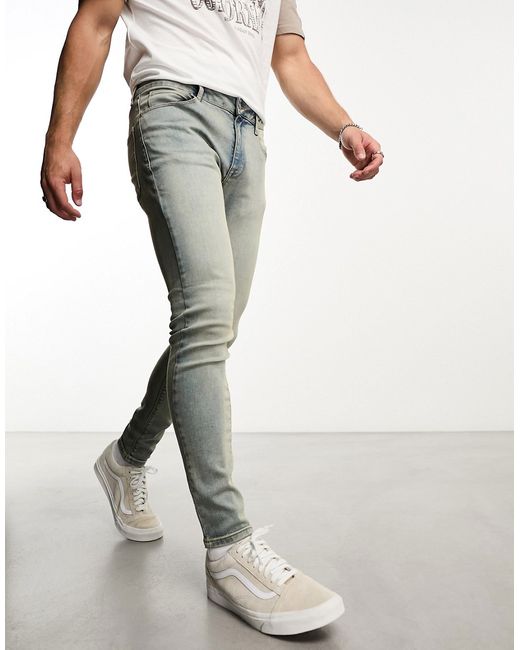 Asos Design spray on jeans with power stretch in mid wash tint-