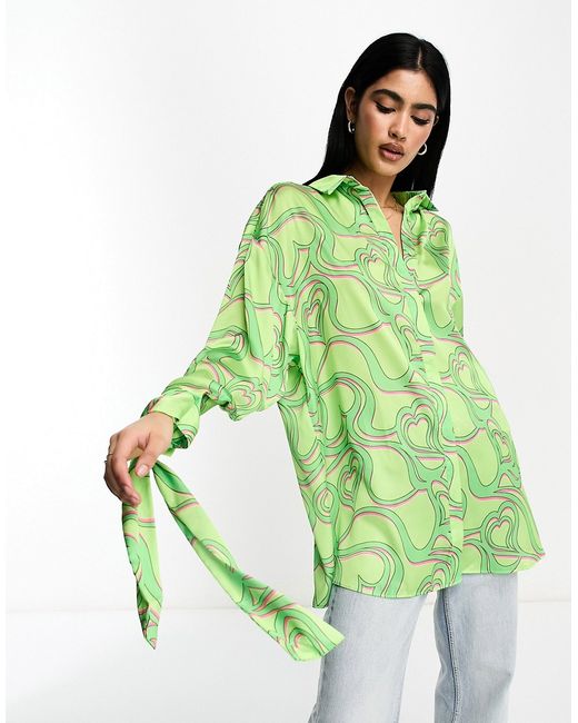 Asos Design oversized satin shirt with tie cuff detail in green heart print-