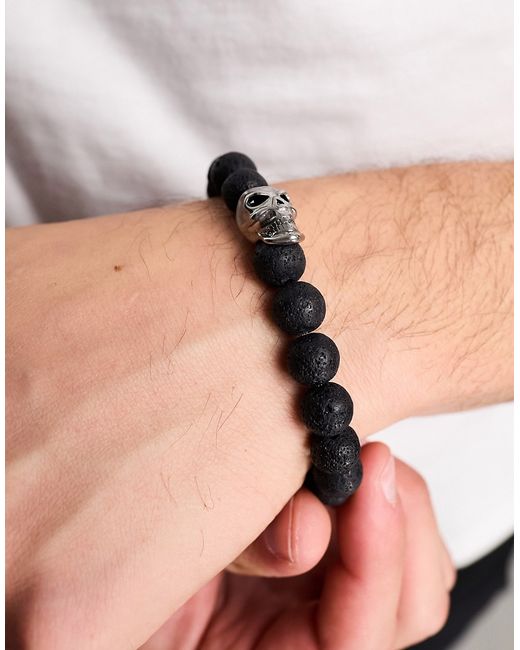 Steve Madden bead bracelet with skull charm in dark