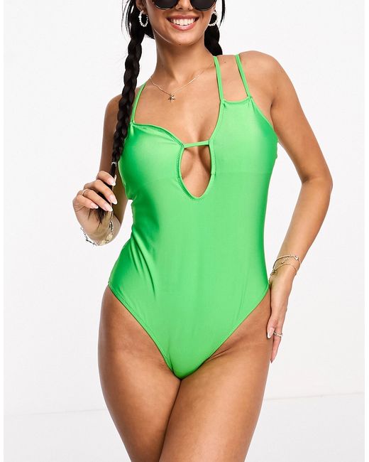 Pieces cut out asymmetric swimsuit in bright