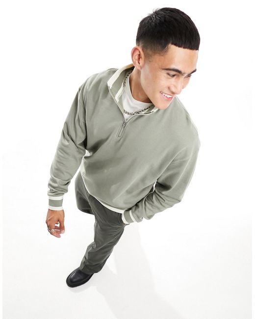 Asos Design oversized half zip sweatshirt with tipping in green-