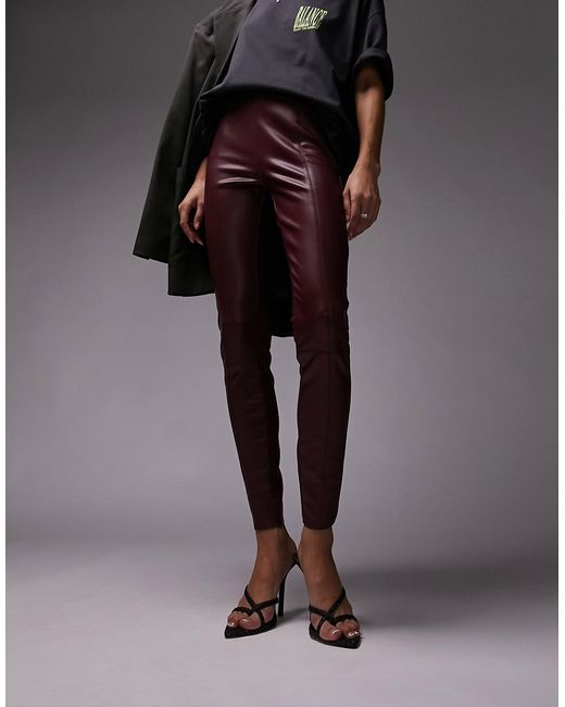 TopShop faux leather skinny pants in burgundy-