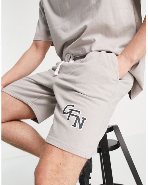 Good For Nothing jersey shorts in stone with varsity logo print part of a set