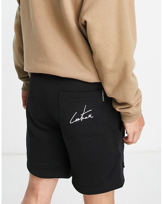 The Couture Club jersey shorts in with logo print part of a set