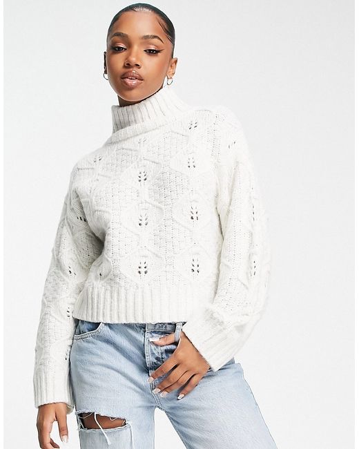 Asos Design cable knit sweater with high neck in cream-