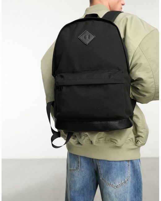 Asos Design backpack in canvas and faux leather