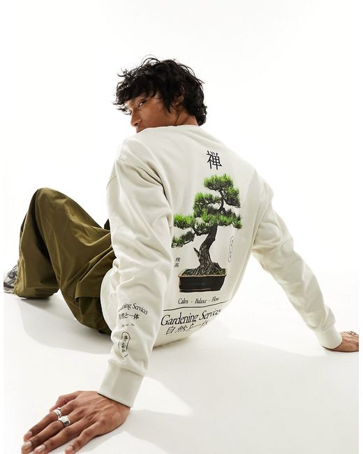 Asos Design oversized sweatshirt with photographic back sleeve print-