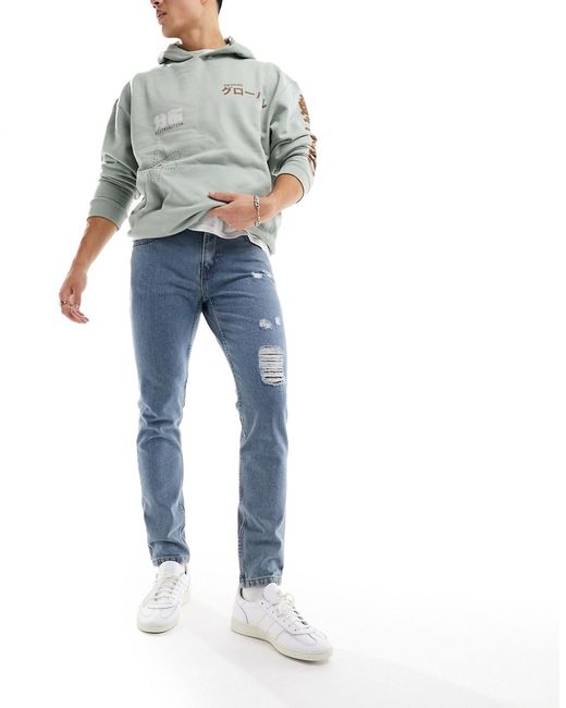 Don't Think Twice DTT rigid tapered fit ripped jeans mid