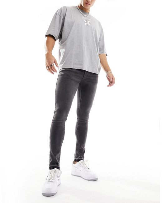 Asos Design spray on jeans with released hem washed