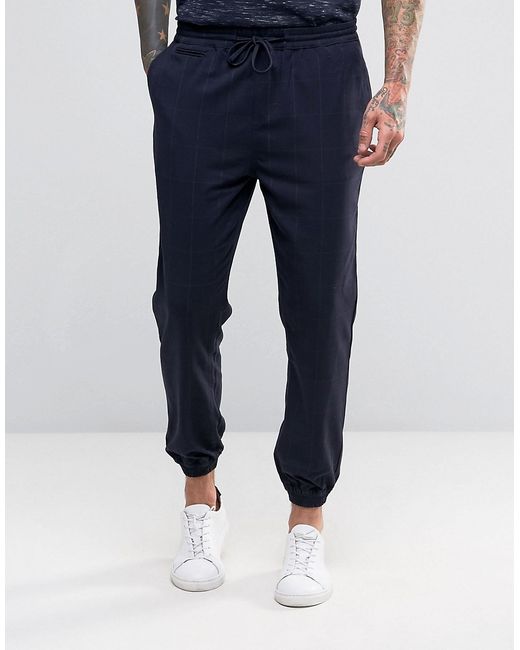 Pull & Bear Cuffed Trousers With Check Print In blue