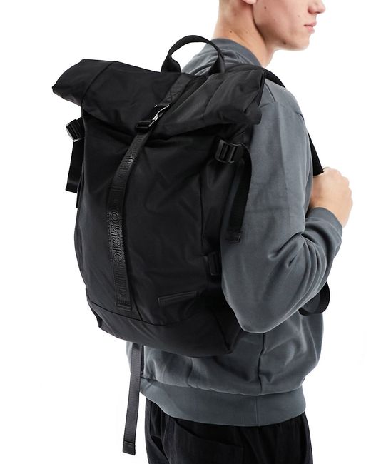 Consigned roll top backpack with buckle fastening