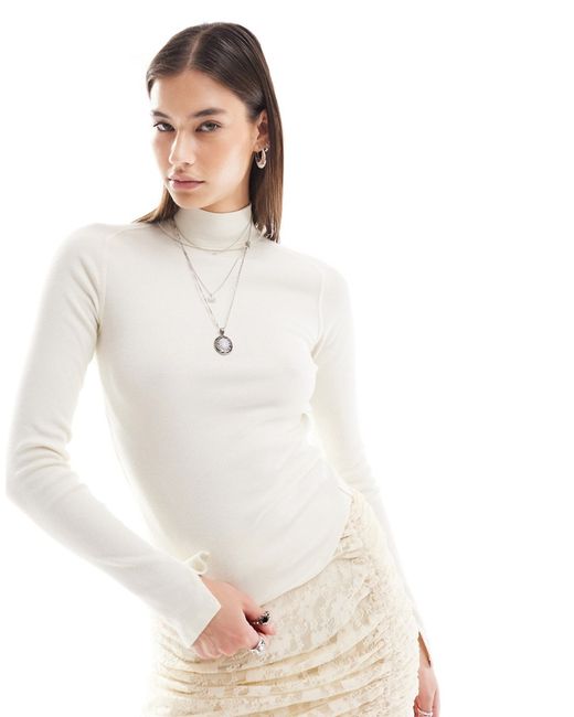 Free People roll neck cropped long sleeve top ivory-
