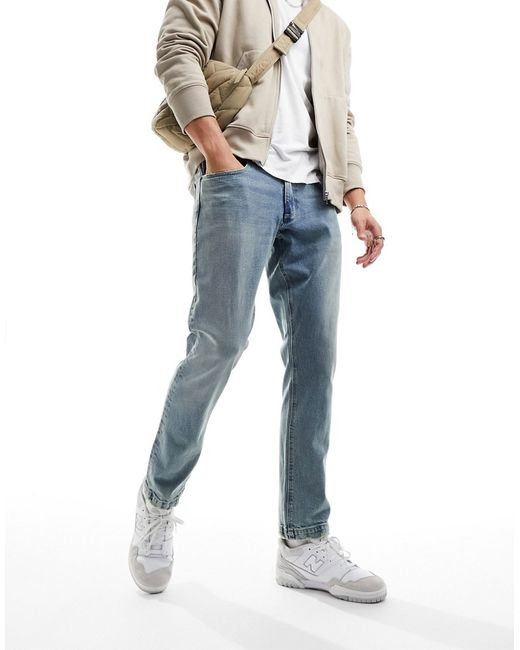 Asos Design slim jeans with frayed hem vintage wash