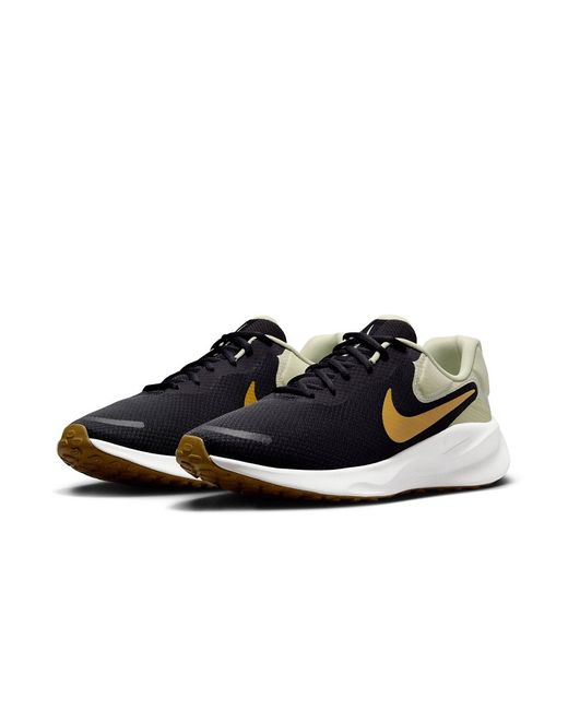 Nike Running Revolution sneakers and gold