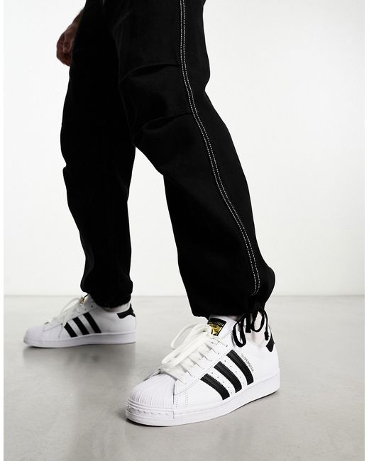 Adidas Originals Superstar sneakers and black