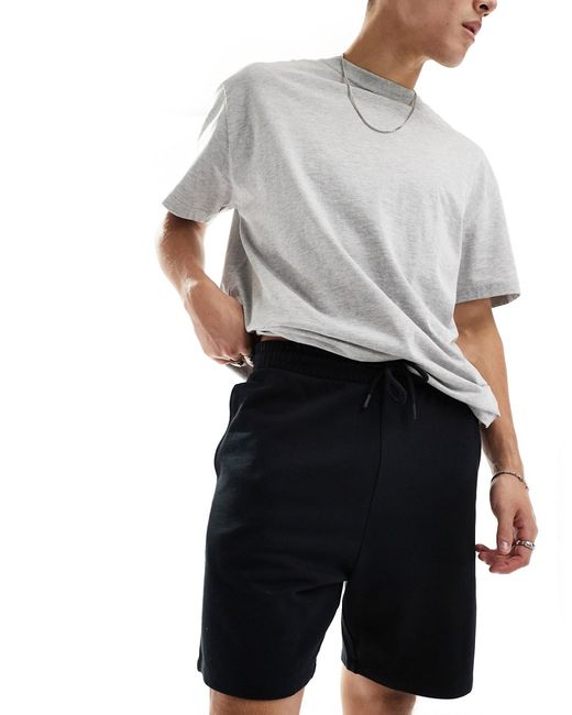 Asos Design mid length slim shorts