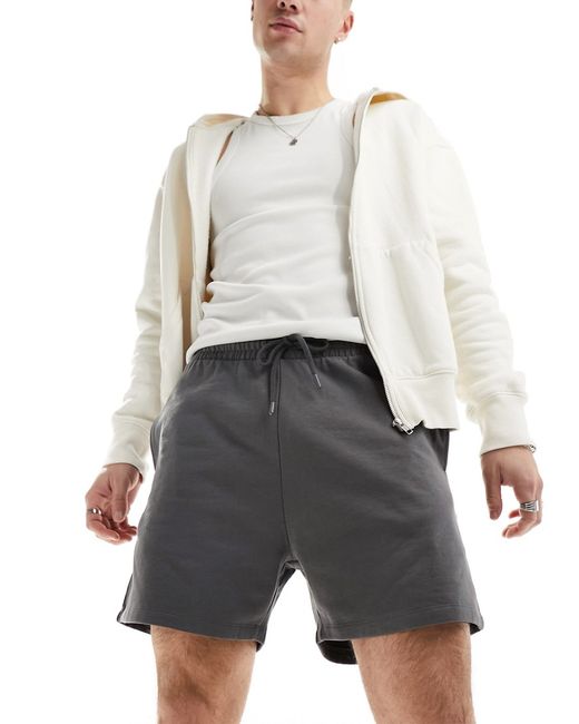 Asos Design shorter length slim shorts washed black-