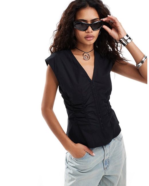Weekday sleeveless blouse top with v neck and hook eye corset waist detail