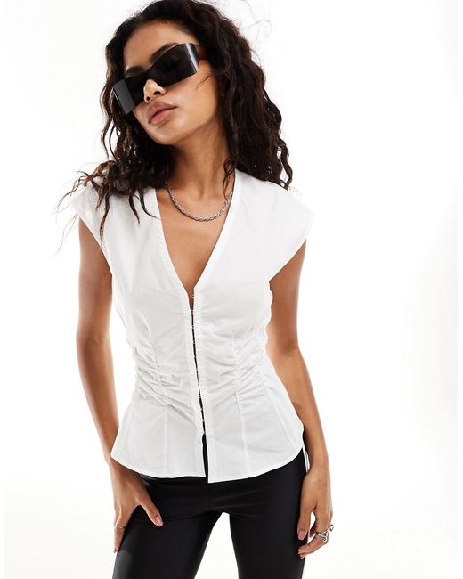 Weekday sleeveless blouse top with v neck and hook bar corset waist detail
