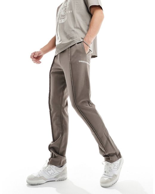The Couture Club raw seam straight leg sweatpants part of a set