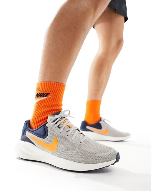 Nike Running Revolution 7 sneakers and orange