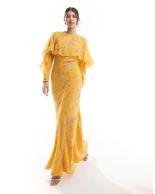 Asos Design Modesty embellished long sleeve ruffle bias maxi dress with cape detail mustard-