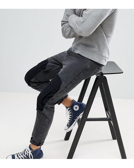 Asos Design Tapered Jeans With Cargo Rip And Repair