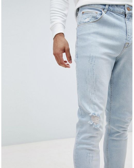 Asos Design Tapered Jeans Light Wash With Abrasions