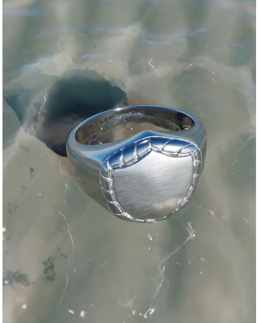 Asos Design waterproof stainless ring with shield design tone
