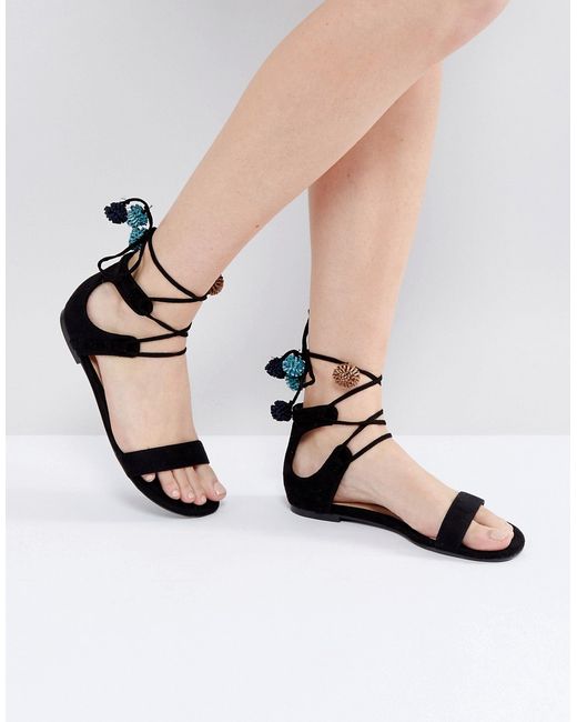 Call it SPRING Mckeague Lace Up Pom Pom Sandals