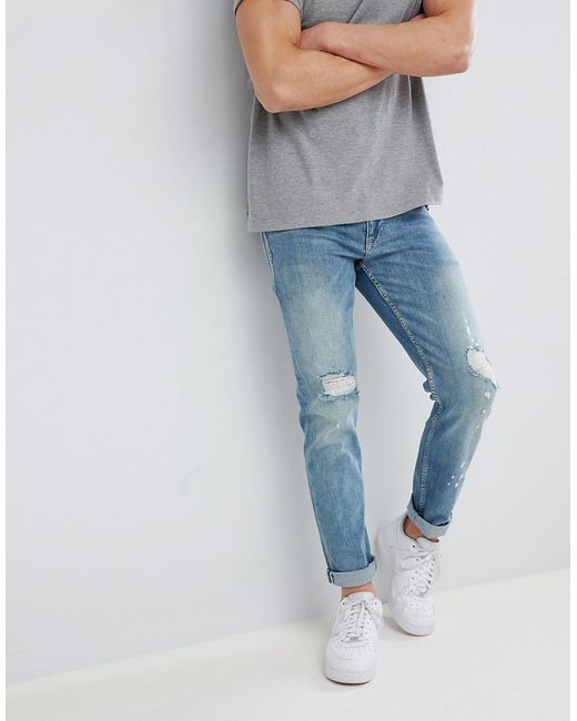 Asos DESIGN Slim Jeans In Mid Wash With Rips
