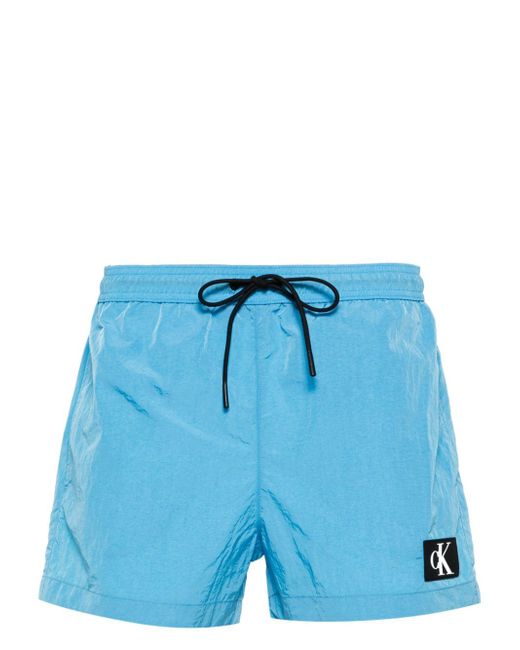 Calvin Klein logo-patch swimming shorts