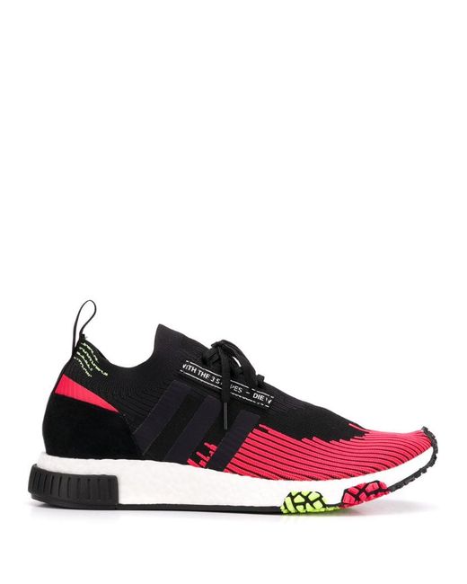 Adidas and red NMD racer solar sneakers