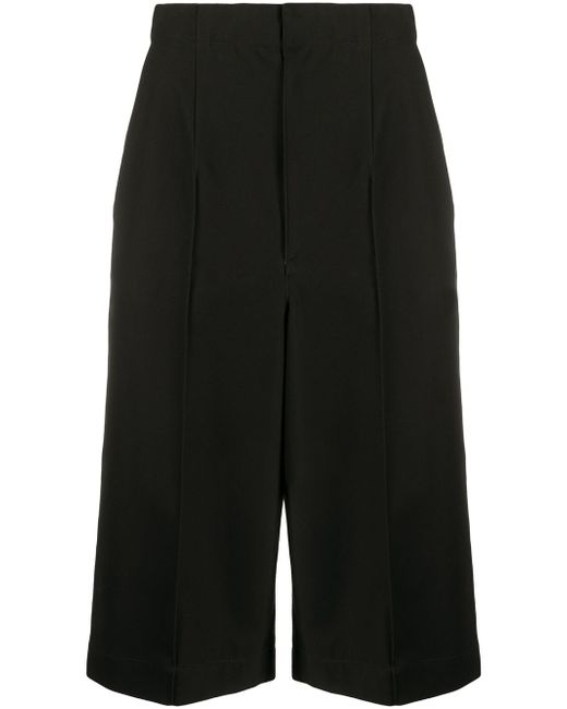 Y's high-rise exposed-seam long shorts
