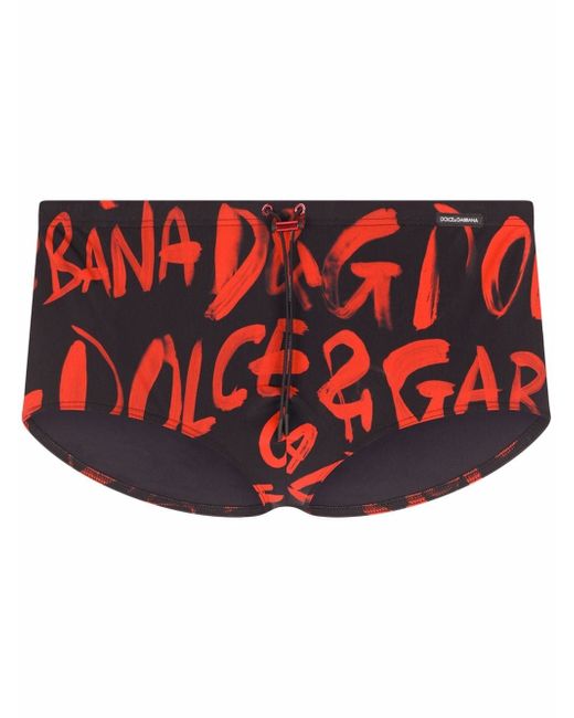 Dolce & Gabbana all over logo-print swimming trunks