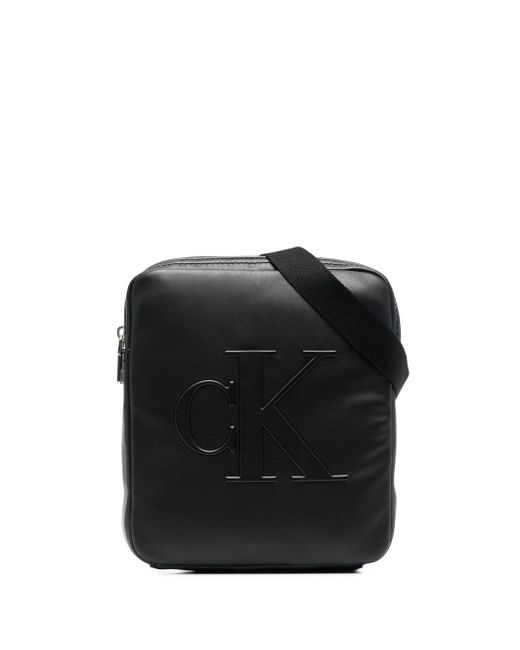 Calvin Klein debossed-logo faux-leather messenger bag
