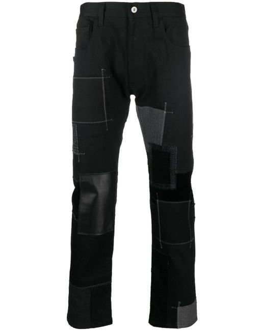 Junya Watanabe patchwork cotton-leather jeans
