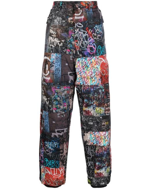 Khrisjoy all-over graphic-print trousers