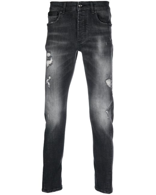 costume national contemporary distressed-detail denim jeans