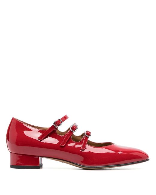 Carel buckled patent leather pumps