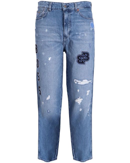 Boss all-over logo patch jeans