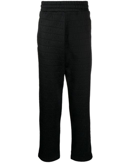 Moschino logo-print trousers