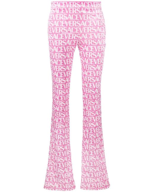 Versace logo-print flared trousers