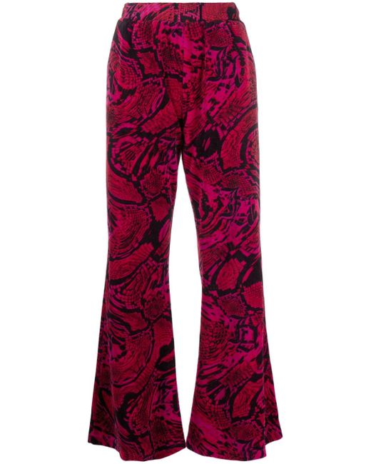 Aries snakeskin-print flared trousers